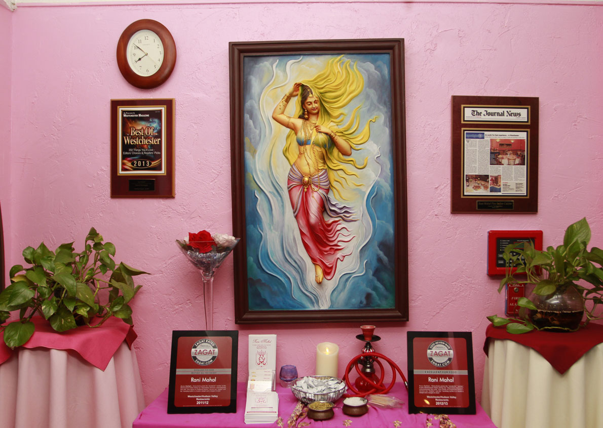 Artwork and awards on the dining room wall