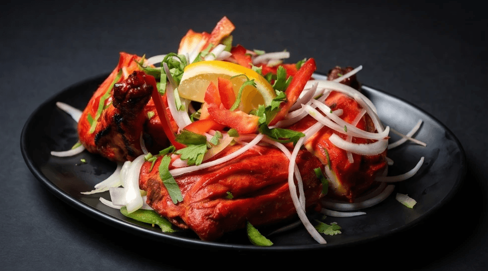 Concept: tandoori chicken, dark studio lighting